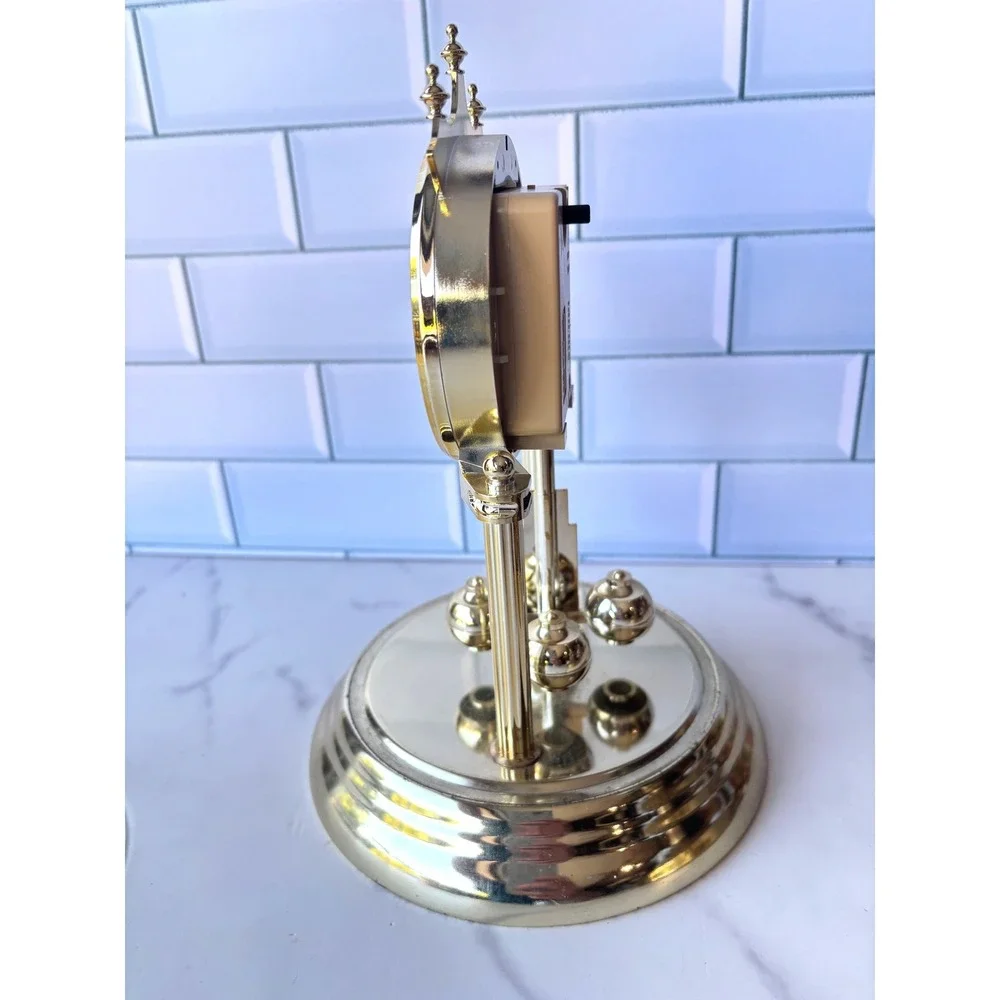 Chronos Quartz Anniversary Clock Gold Tone Glass Dome Floral Face Rotating Ball